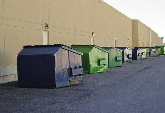 construction waste bins waiting to be picked up by a waste management company in Coram, NY